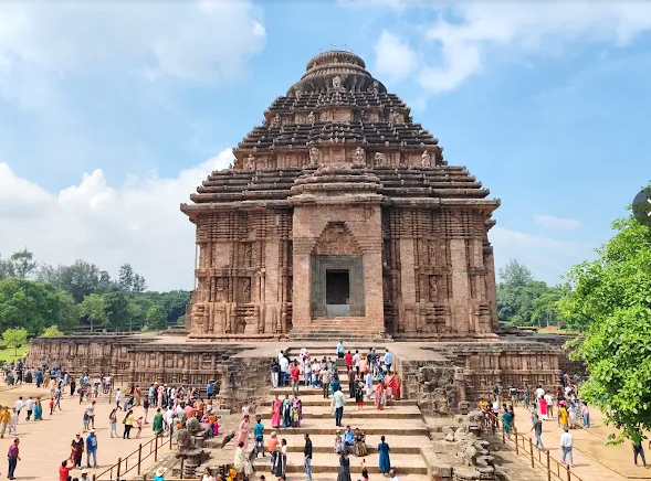 Workers manually excavating a tunnel at Konark Sun Temple under archaeological supervision for controlled sand removal from the sanctum.