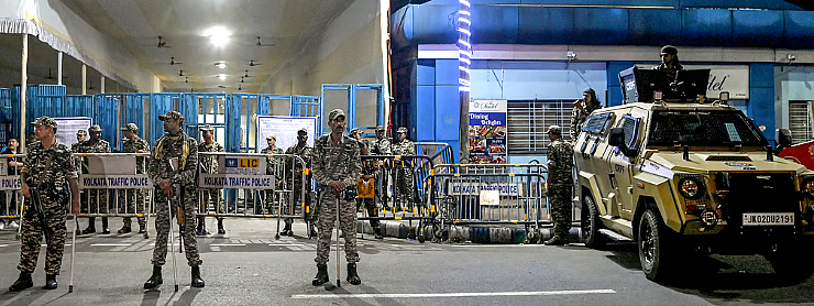 Security personnel deployed around EVM strongrooms in West Bengal enforcing 200-metre restricted zone ahead of vote counting.