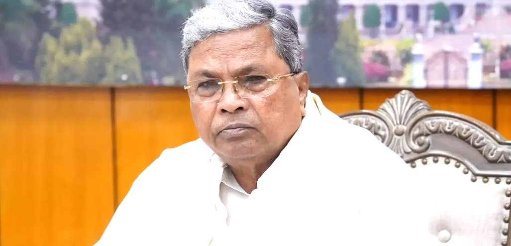 Siddaramaiah greets DK Shivakumar during Karnataka Congress leadership transition.