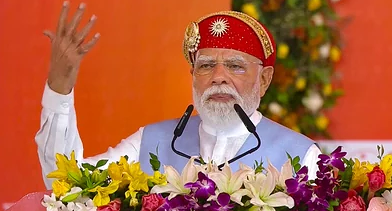 Narendra Modi speaking at a political meeting in New Delhi during NDA event.