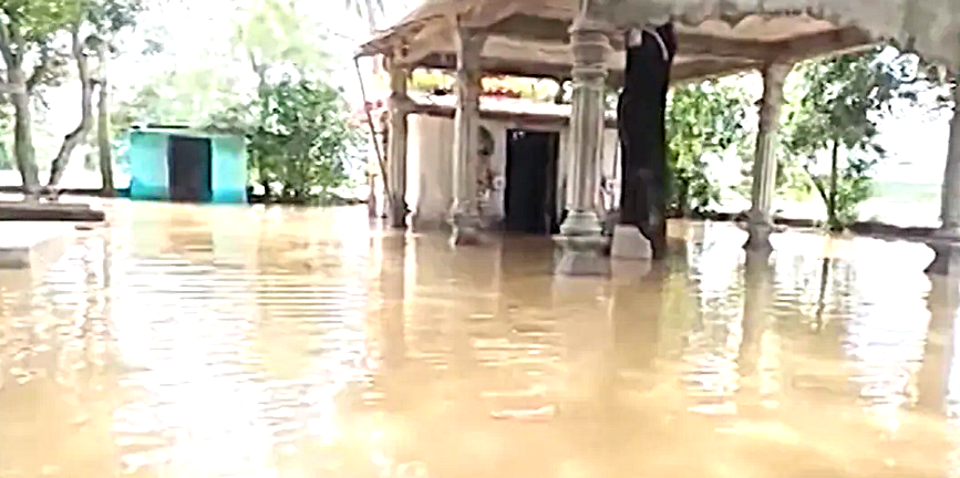 Devotees offer prayers inside the flooded Swapneswar Mahadev Temple in Cuttack.